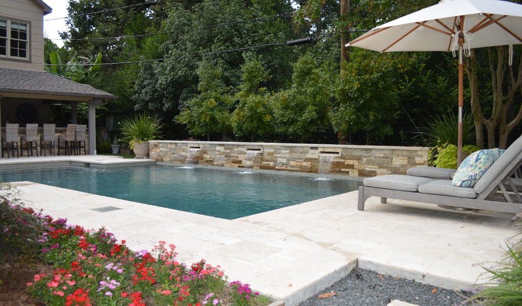 Garden oasis complete with pool, fountains and outdoor kitchen.