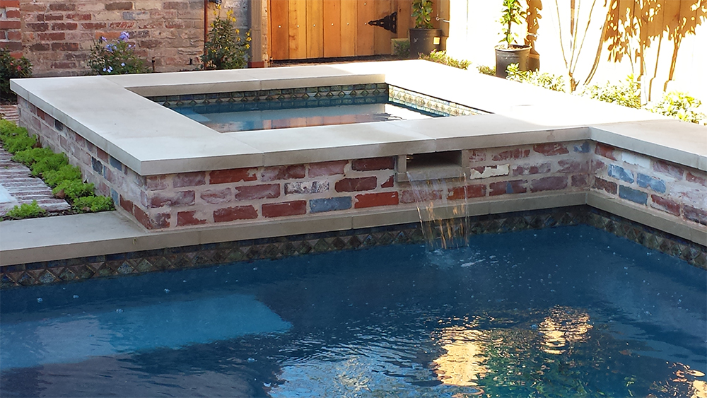 Detail on a hot tub with a spill-over edge designed and built by Prewett, Read & Associates.