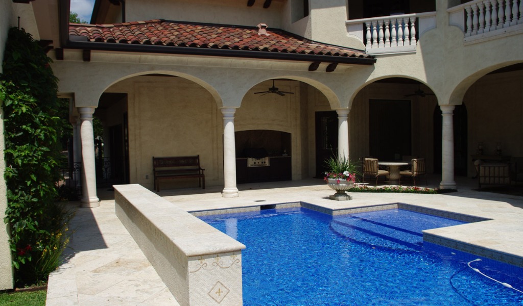 Mediterranean-inspired backyard swimming pool in Houston, Texas.