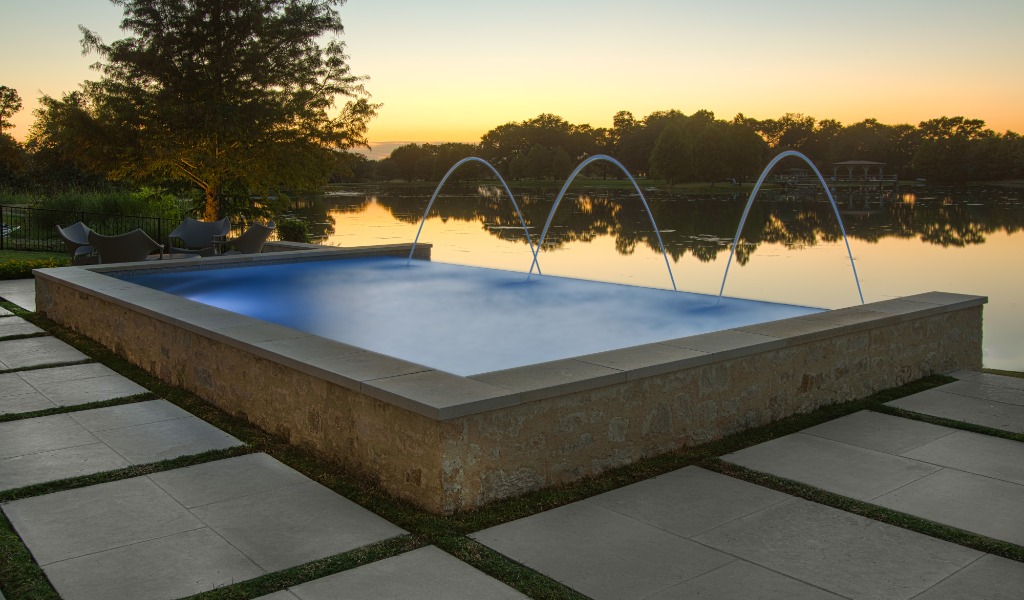 A custom-designed infinity pool at sunset.
