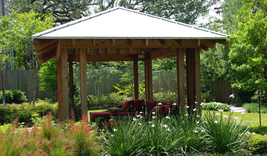 A custom-designed gazebo in a Southern garden providing shade from Houston heat.