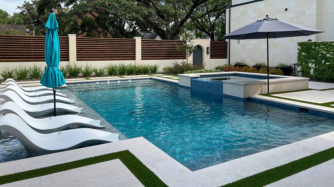 Custom backyard swimming pool featuring a modern minimalist design